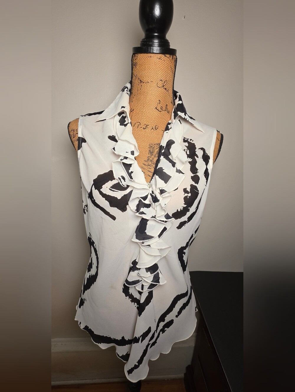 Sleeveless Ruffle Front Blouse in White with Black Abstract Print